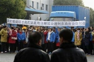Workers protest wage cuts at electronics factory in Shanghai