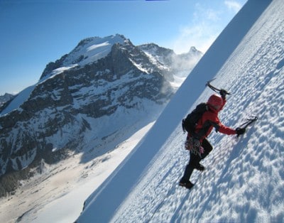 scaling an icy summit