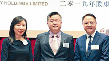 Jason Hui, chairman of Shimao Services Holdings and the son of Xu Rong Mao (middle)