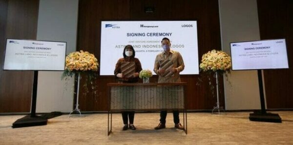 The new partners signing their deal in Jakarta