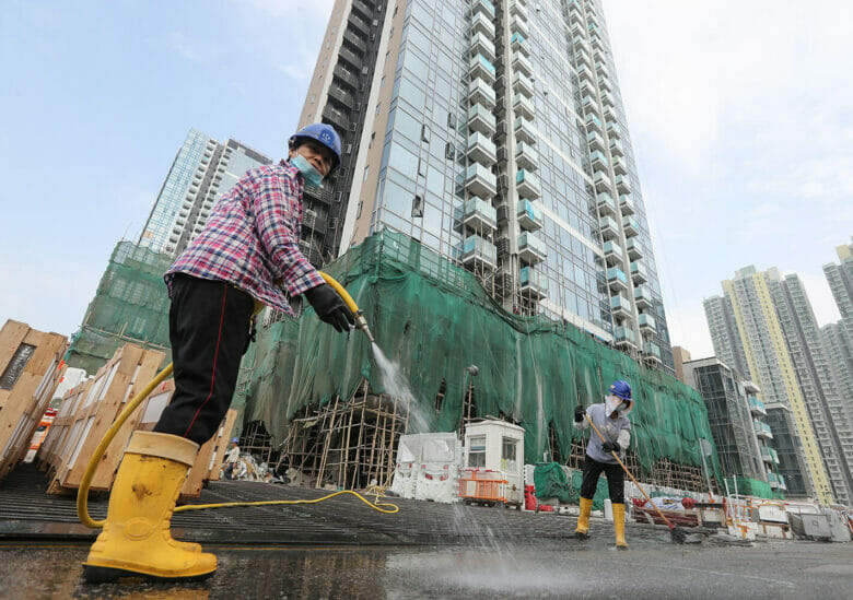 Workers at COLI's One Kai Tak housing complex in Hong Kong (Getty Images)